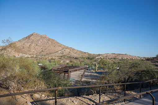 Arizona State Route Highway 51 and distant mountains as seen from a family-friendly Phoenix Mountain Preserve also known as Dreamy Draw desert recreation area