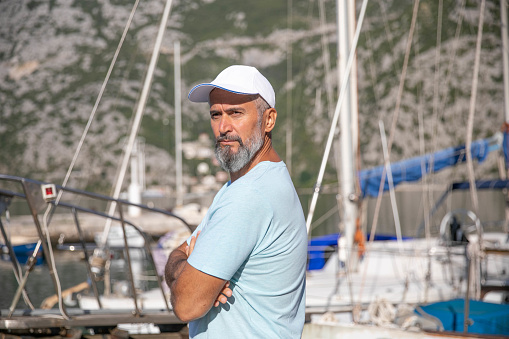 Portrait of a handsome mature man on a sailboat