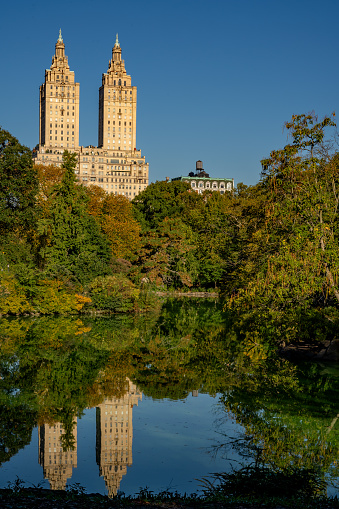 New York, NY - US - Oct 11, 2023 The San Remo reflecting in Central Parks Lake. An iconic Beaux-Arts apartment building by Emery Roth, built in 1930 and known for its twin towers.