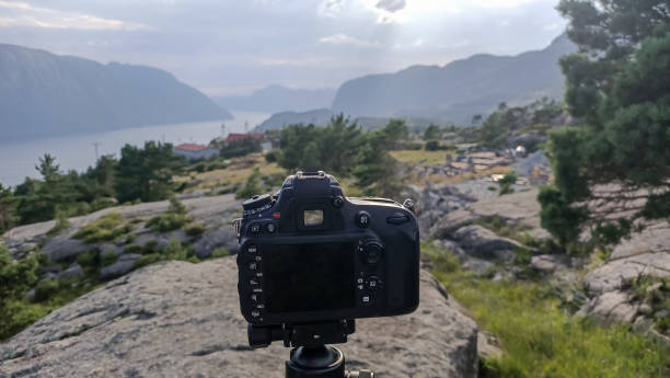 istock Photocamera on tripod for landscape picture 1750774013