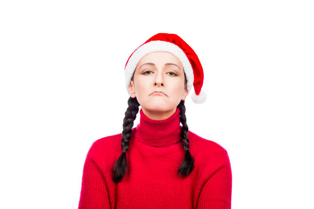 Offended Dissatisfied Christmas Girl in Santa Hat  isolated on a white background.