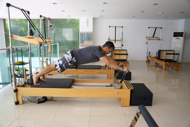 istock young sporty man doing reformer pilates 1750794176