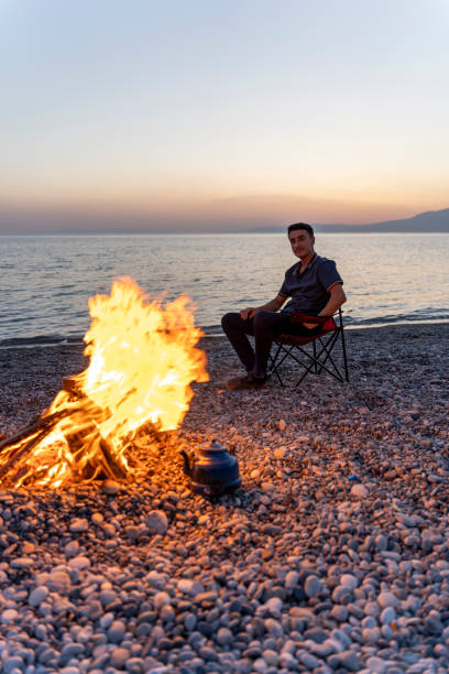 istock Young people camping by the sea. 1750805264