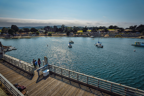 Fisherman's Wharf is a historic wharf in Monterey, California, United States. Used as an active wholesale fish market into the 1960s, the wharf eventually became a tourist attraction as commercial fishing tapered off in the area.\n\nFisherman's Wharf is technically known as The Old Fisherman's Wharf, to distinguish it from the current commercial wharf (known as Municipal Wharf #2).