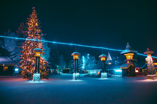 The Arctic Circle ostensibly cuts right through Santa Claus Village. A blue illuminated line denoting the Arctic Circle at its position in 1865 is painted across the park. Visitors officially enter the Arctic area when they cross the line. There is a popular photo spot for visitors in Rovaniemi, Lapland, Finland