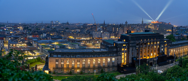 view of St. Andrew's House and Edinburgh, Scotland skyline at dusk