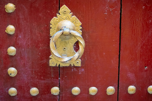 Two Handwriting Chinese blessing Fu on the  traditional chinese  wooden door with brass handle. The Fu with red background or writing red, luck and happiness in Chinese connotation