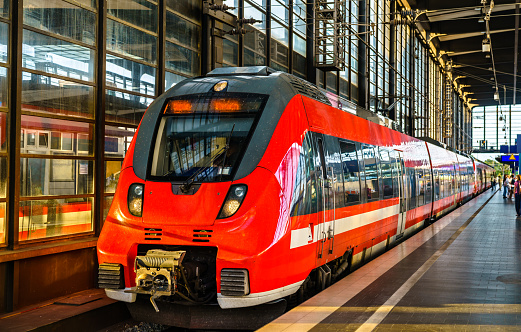 Red regional train at Zoologischer Garten Station in Berlin, Germany