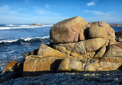 Large boulders on the beach at Pacific Grove, California.