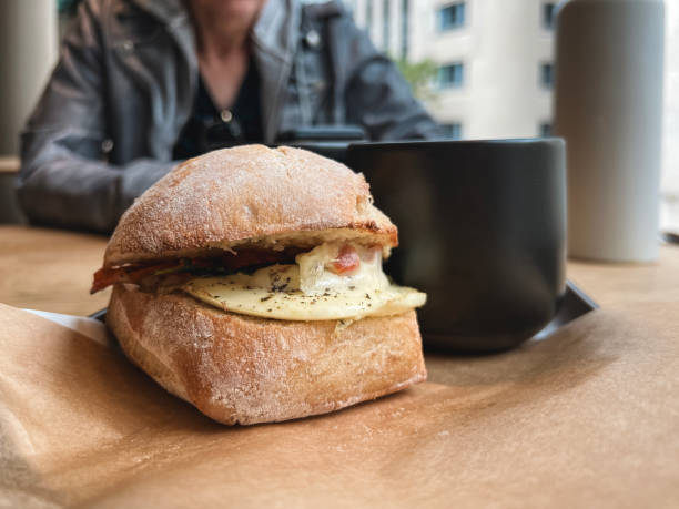 Delicious Breakfast Sandwich and Coffee with a Friend