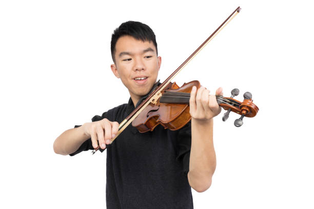 istock Teenage boy playing violin isolated 1750921458