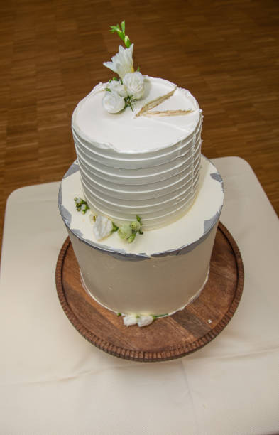 istock white  wedding cake decorated with flowers 1750933638