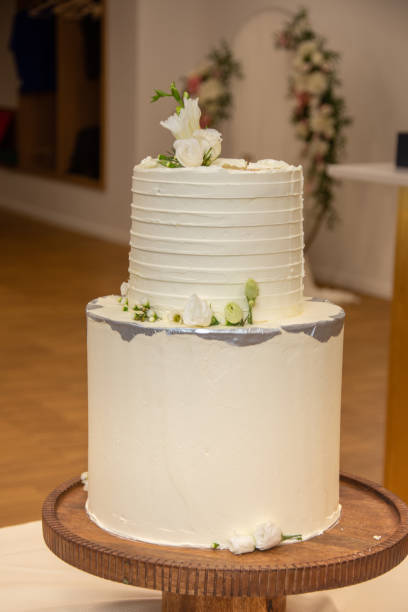 istock white  wedding cake decorated with flowers 1750935222