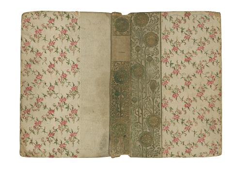Antique hardcover book with Victorian floral pattern.