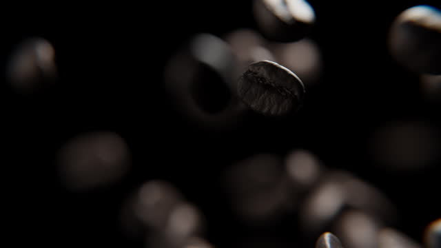 Close up of Coffee beans falling against a black background