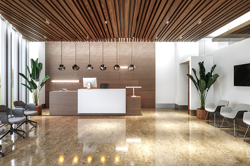 3D render of the interior lobby of a modern office / healthcare clinic. The floor is glossy beige marble, reflecting ambient lighting from hanging pendant lights. A sleek reception desk made of dark wood is present with copy space.