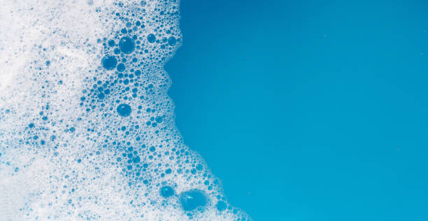 istock Detergent foam bubble on water. Blue background, Soap sud 1751044631