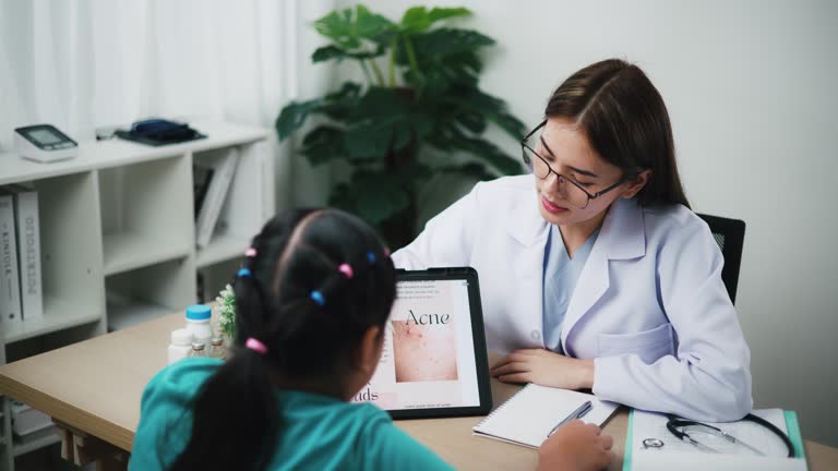 Young female Professional Healthcare Dermatology Check-Up with Teenage Patient