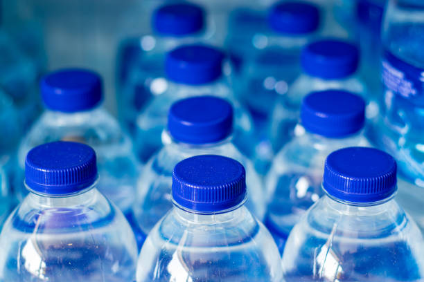 istock Mineral water bottles in a row with blue caps 1751088050