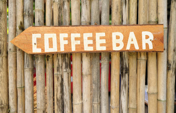 Sign pointing the way to a coffee shop.