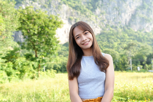 Female tourist smiling happily in nature