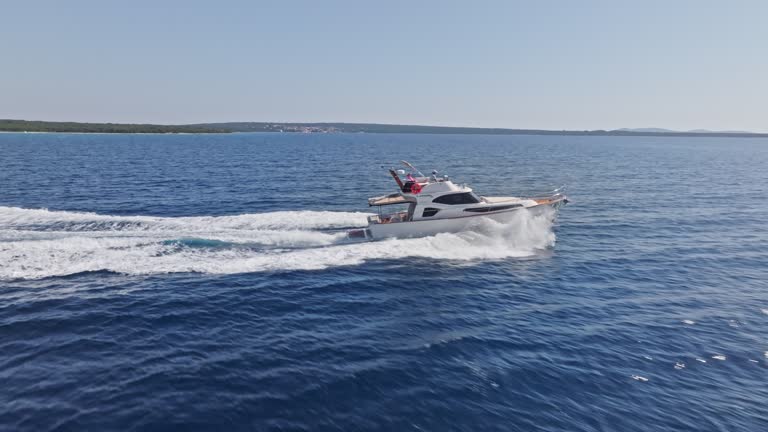 AERIAL Yacht travelling at sea on a sunny day