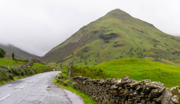 istock a quiet road running through the Lake District, Cumbria, UK 1751113973