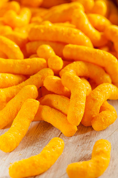 istock Unhealthy Orange Puffy Cheese Crisps 175113429