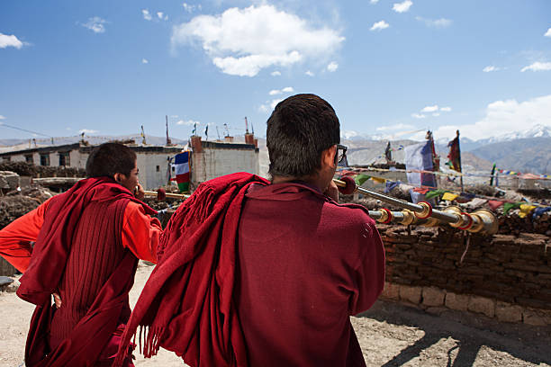 istock Tibetan monks playing buddhist horns 175113837