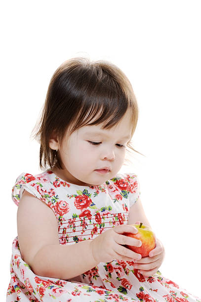 istock Young girl holds apple 175114335