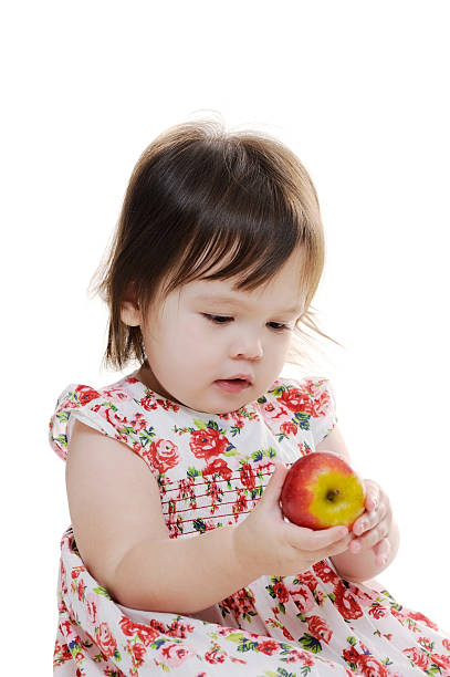 istock Little girl holds apple 175114341