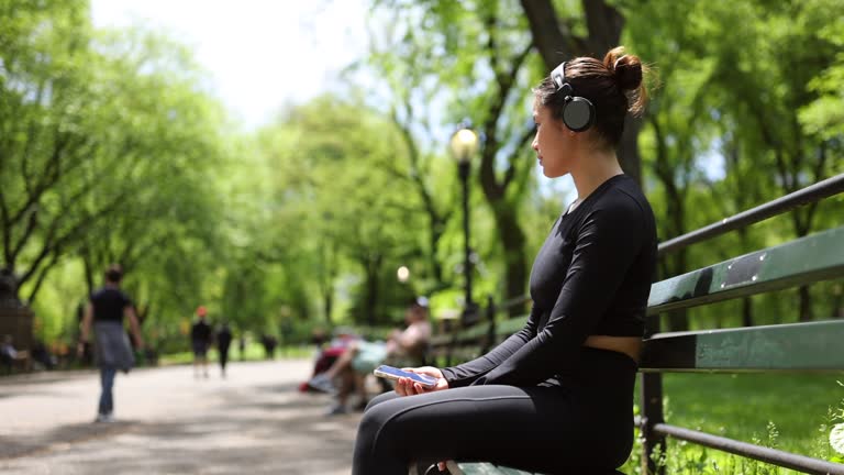 Girl checking jogging mobile app after jogging