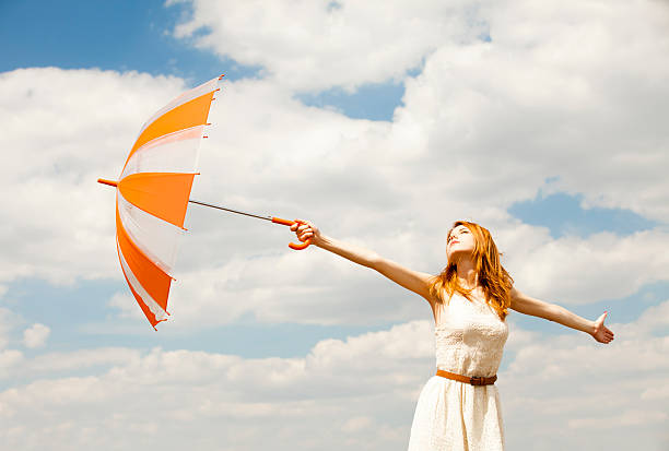 istock Girl with umbrella at sky background. 175116522