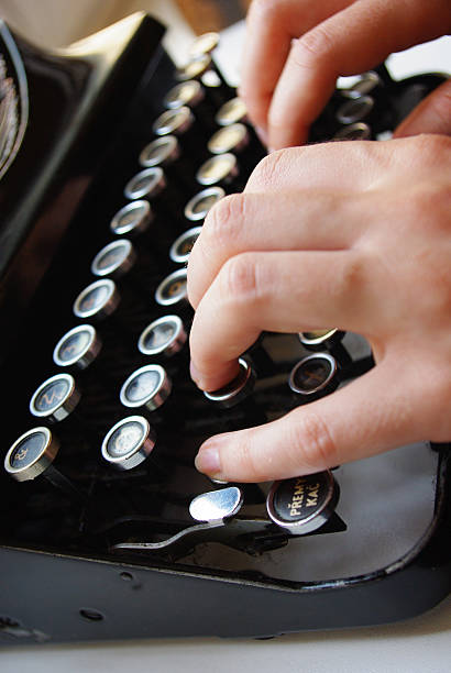istock Detail of the keyboard, typewriter with two hands 175117410