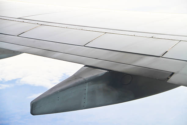 istock Wing of the plane on sky background 175117784