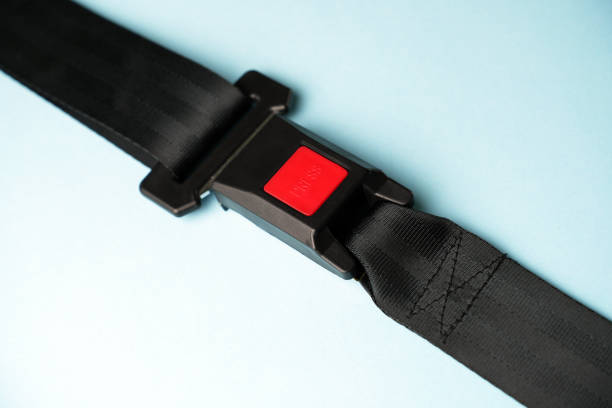 istock Fastened seat belt on blue background with copy space 1751192826