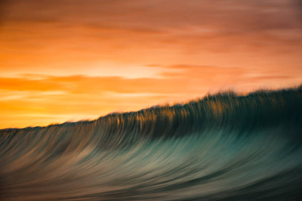 istock Motion blur of smooth wave forming in golden light 1751227976