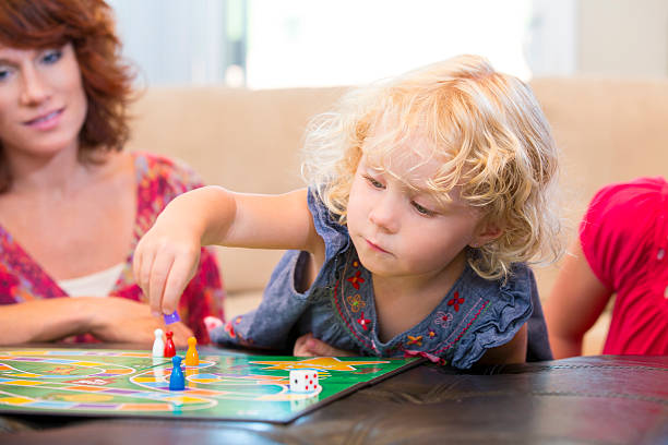 istock Little girl making her next board game move 175123420