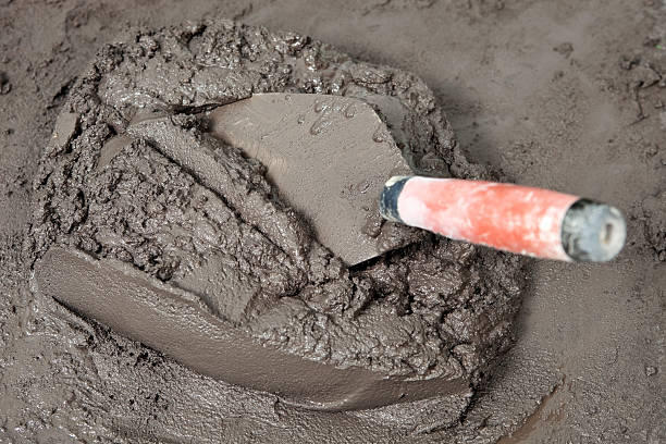 istock Dark Wet Mortar and Trowel 175125767