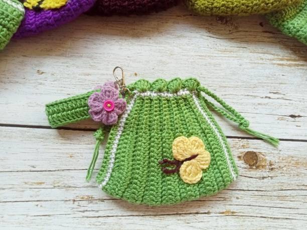 istock crochet drawstring bag coin bags handmade multicolor craft background texture 1751257817
