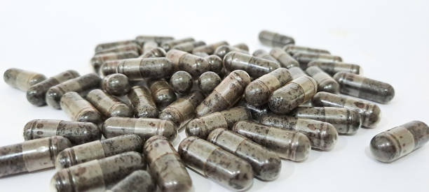 istock Black cumin capsules or commonly called (Habbatussauda) are isolated on a black background. Nigella sativa 1751262085
