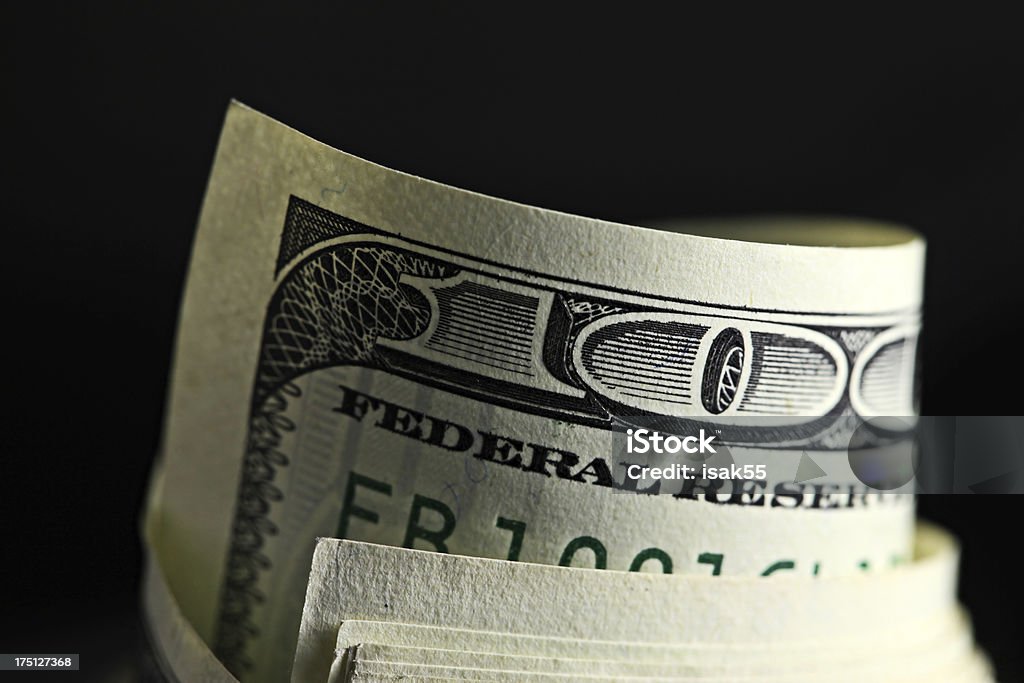 Money roll with US dollars Money roll with US dollars. Macro image. Paid - Single Word Stock Photo