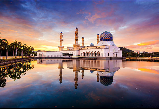 Mosque with sky filled colour sunrise stock photo
