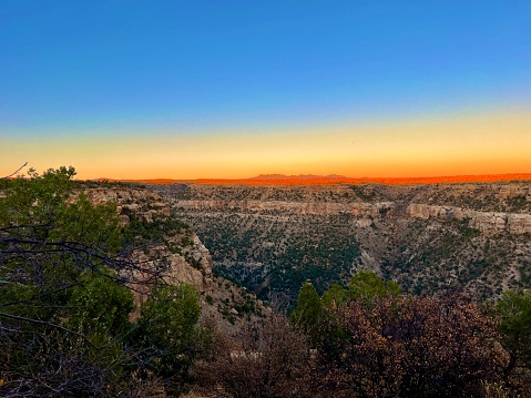 A view of a mountain range at sunset in Zion National Park in Utah, USA.