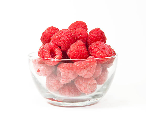 Raspberries in a Glass Bowl stock photo