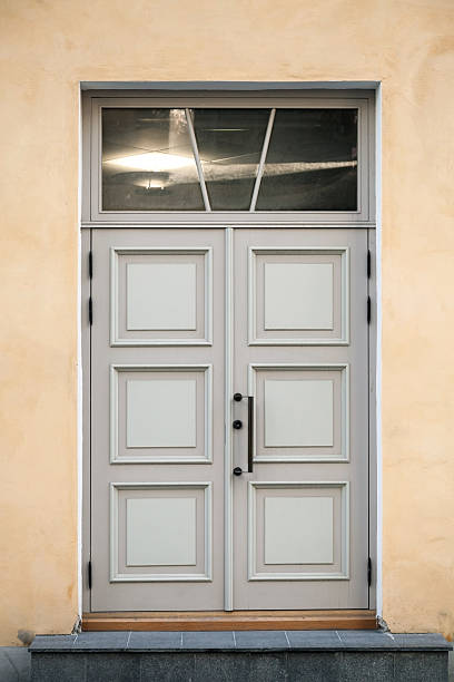istock Old wooden door with window and decorative elements 175128963