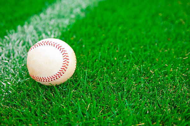 istock Baseball on Outfield Grass at a Baseball Game 175129386