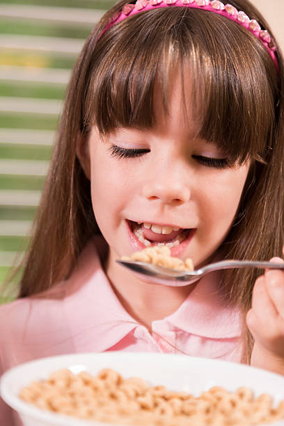 istock Food:  First grader enjoying a bowl of cereal for breakfast. 175129780