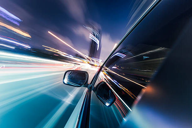 speeding car - araba motorlu taşıt lar stok fotoğraflar ve resimler