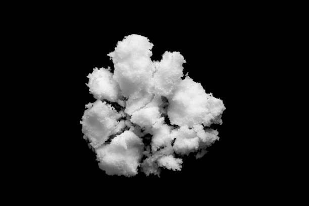istock White snow isolated on black background close up 1751322416
